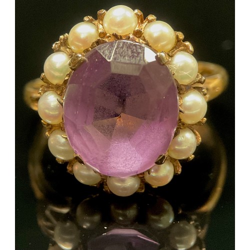 443 - An amethyst and seed pearl dress ring, 9ct gold shank, 4.6g gross