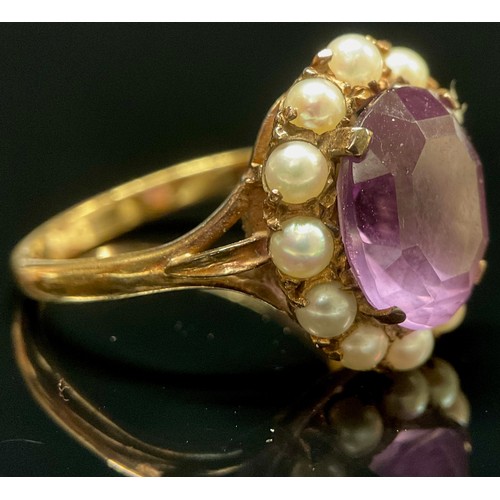 443 - An amethyst and seed pearl dress ring, 9ct gold shank, 4.6g gross