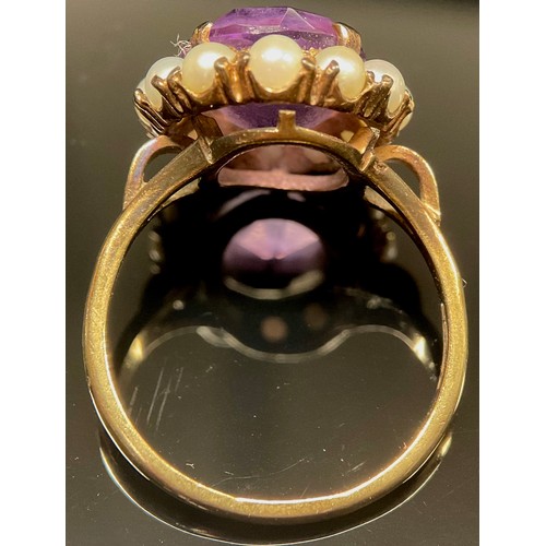 443 - An amethyst and seed pearl dress ring, 9ct gold shank, 4.6g gross