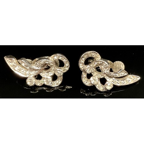 445 - A pair of diamond effect past clip on earrings, silver mounts.