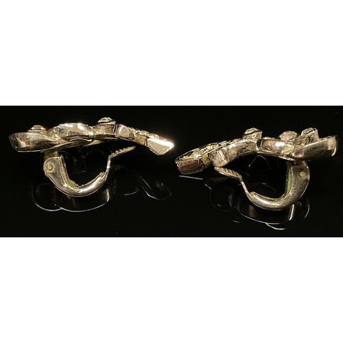 445 - A pair of diamond effect past clip on earrings, silver mounts.