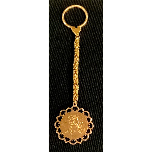 447 - A gold coloured metal fob pendant, fancy link chain