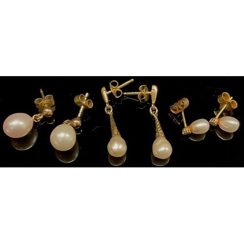 450 - Three pairs pearl drop earrings, 9ct gold and yellow metal mounts, 4.6g gross