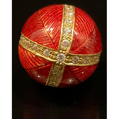 452 - A silver gilt red enamelled egg pendant, paste detailed quarters, stamped 925 sil, 5.5g gross