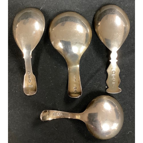 207 - A George III silver caddy spoon, hand chased and engraved, London 1820; three others similar, 40g