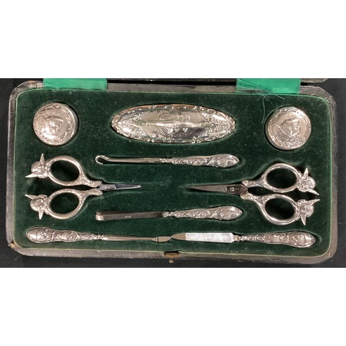 209 - A late Victorian silver mounted manicure set, comprising nail buffer, pair of silver hinged pots emb... 