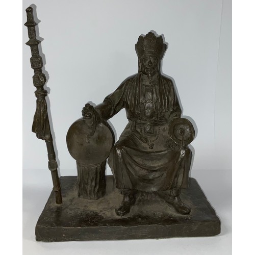 211 - A large bronze figure, of a seated Shaman, 33cm high