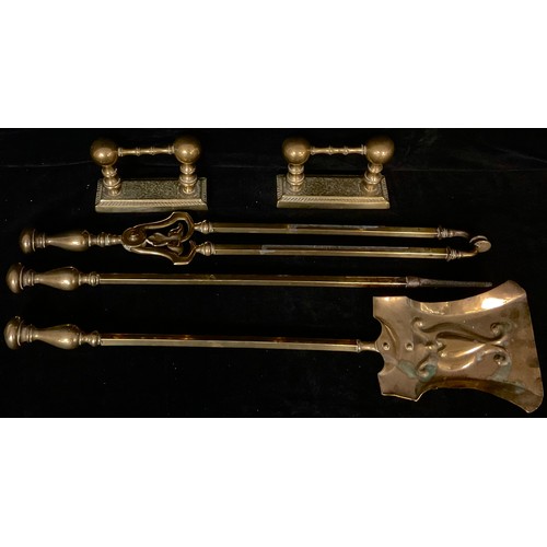 212 - A set of three late 19th century brass fire irons, knop finials; a similar pair of brass fire dogs (... 