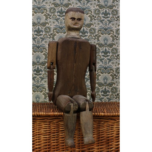 6070 - Folk Art - a good 19th century carved and painted wooden doll, the carved and painted wooden head in... 