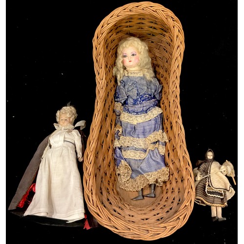 258 - Toys & Juvenalia - a wax shoulder head doll with later overpainting, fixed inset glass eyes, blonde ... 