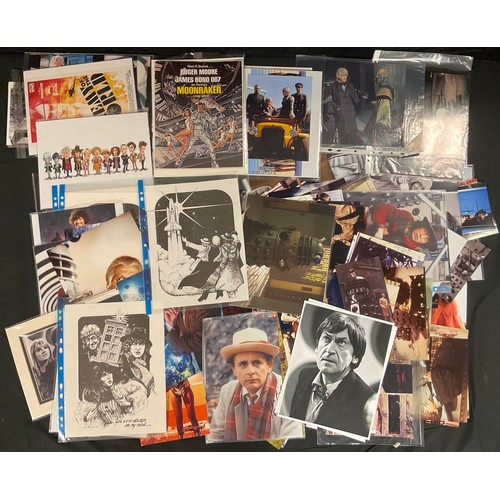 261 - Sci-if interest - a folio of Dr Who prints and photographs, a Moonraker press pack, Dr Who art works... 