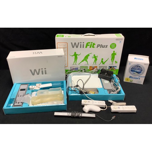 279 - A Nintendo Wii with controllers, sports resort pack games & wifi fit plus.