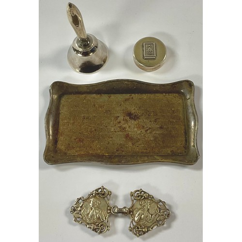 97 - A George V silver dressing table trinket tray, Birmingham 1930; a silver hafted table bell; a silver... 