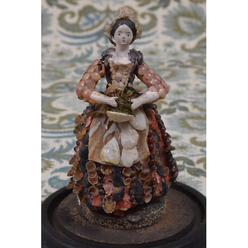 6071 - Folk Art, Maritime and Conchology Interest - an early to mid 19th century shell doll, the wooden sho... 