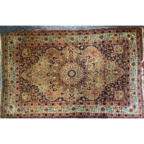 402 - ***BELONGS TO CARRADALE PAID OUT 05/06/24**A Middle Eastern woollen rug or carpet, stylised floral d... 