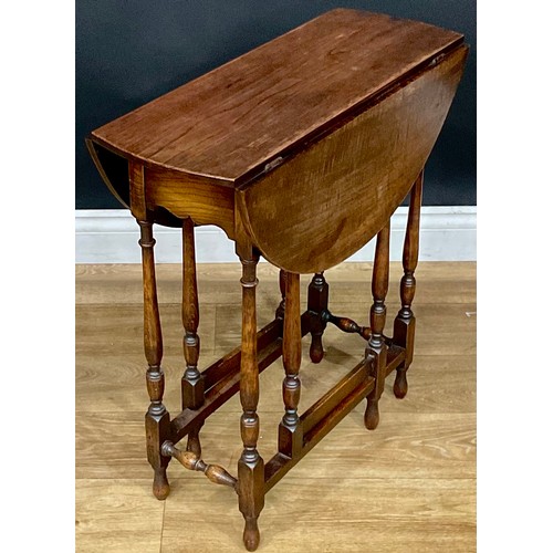 421 - An early 20th century oak spider leg table, c.1920, 64.5cm high, 25cm extending to 68cm long, 61cm d... 