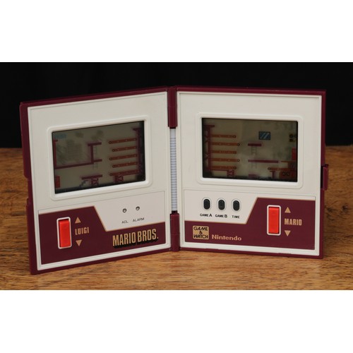 6105 - Retro Gaming & Technology - a Nintendo Mario Brothers 'game and watch' multi screen device, model no... 