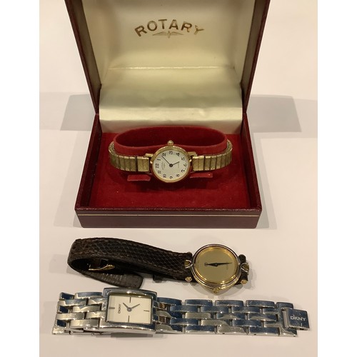 514 - A lady's Rotary watch, boxed; a lady's Gucci watch; another DKNY (3)