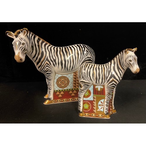 135 - A pair of Royal Crown Derby paperweights, Zebra and Baby Zebra, gold stoppers, printed marks