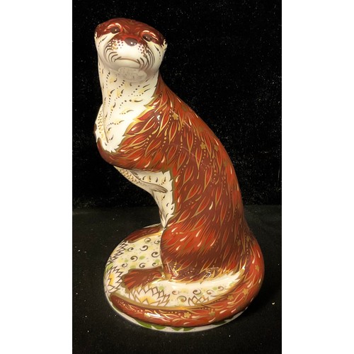 140 - A Royal Crown Derby paperweight, Playful Otter, gold stopper, 15cm, printed marks in red