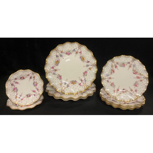 142 - A set of three Royal Crown Derby Royal Antoinette pattern shaped circular dinner plates, set of four... 