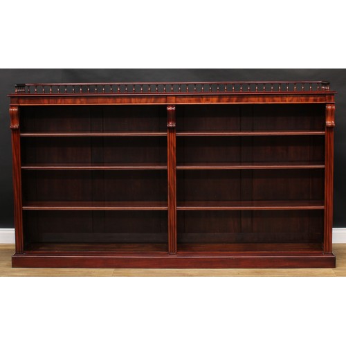 2206 - A Victorian mahogany low library bookcase, three quarter balustrade gallery above six adjustable she... 