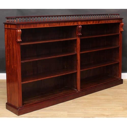 2206 - A Victorian mahogany low library bookcase, three quarter balustrade gallery above six adjustable she... 