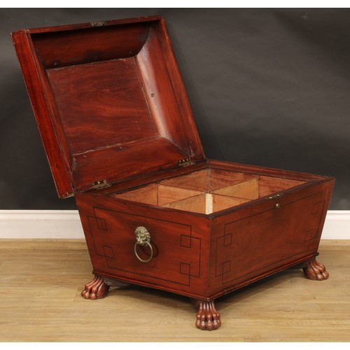 2207 - A Regency mahogany sarcophagus cellarette or wine cooler, hinged top enclosing a compartmented inter... 