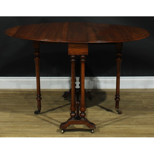 2208 - A Victorian ripple walnut Sutherland table, oval top with fall leaves, turned supports and stretcher... 