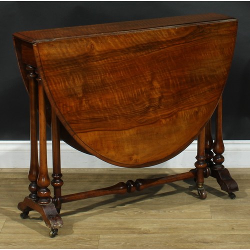 2208 - A Victorian ripple walnut Sutherland table, oval top with fall leaves, turned supports and stretcher... 