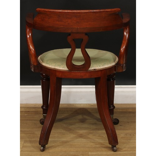 2209 - A Victorian mahogany desk chair, curved cresting rail, lyre-shaped splat, stuffed-over seat, turned ... 