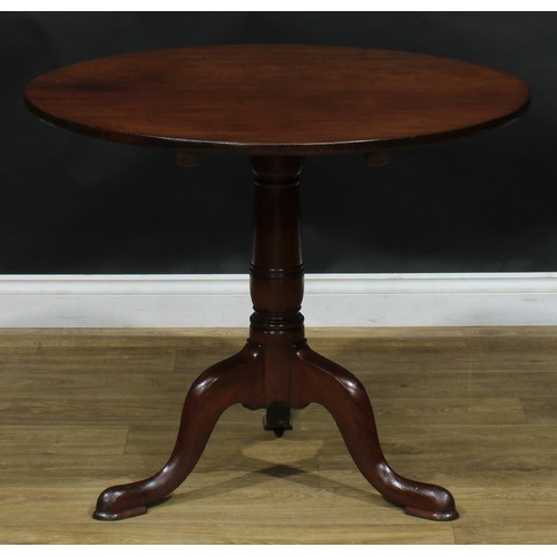 1937 - A George III mahogany tripod occasional table, near-circular tilting top, turned column, cabriole le... 