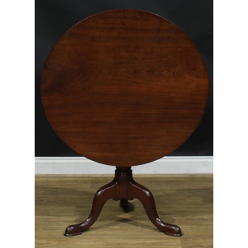 1937 - A George III mahogany tripod occasional table, near-circular tilting top, turned column, cabriole le... 