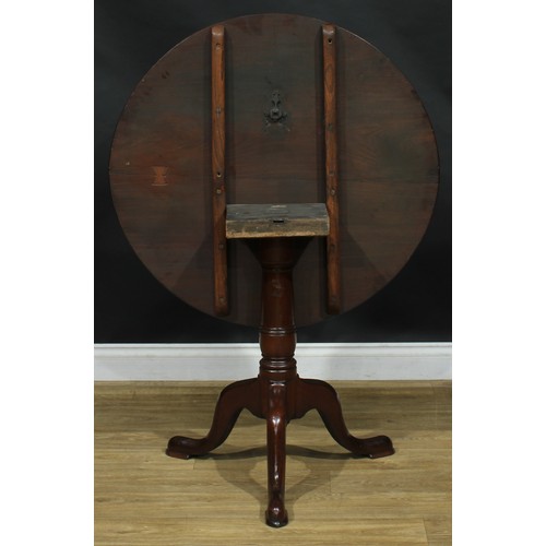 1937 - A George III mahogany tripod occasional table, near-circular tilting top, turned column, cabriole le... 