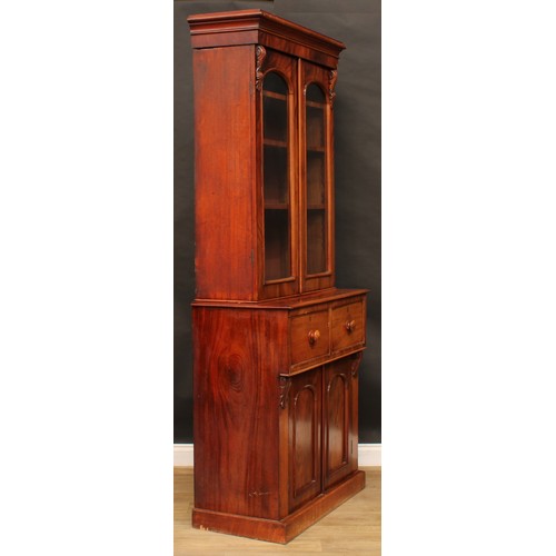 2210 - A Victorian mahogany library bookcase, moulded cornice above a pair of glazed doors enclosing three ... 