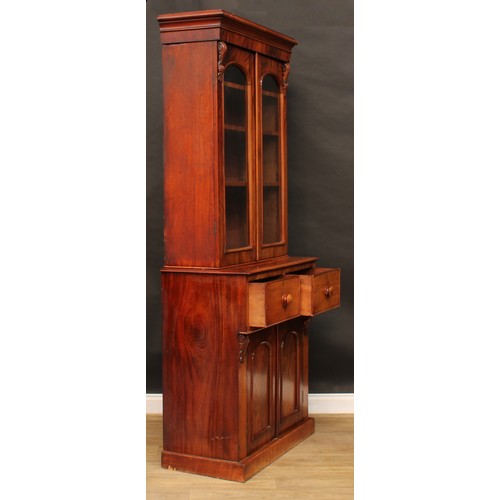 2210 - A Victorian mahogany library bookcase, moulded cornice above a pair of glazed doors enclosing three ... 