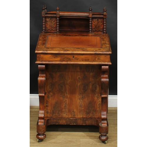 1581 - A 19th century burr yew Davenport desk, possibly Irish, shaped superstructure with a pair of small d... 