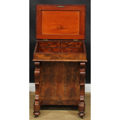 1581 - A 19th century burr yew Davenport desk, possibly Irish, shaped superstructure with a pair of small d... 