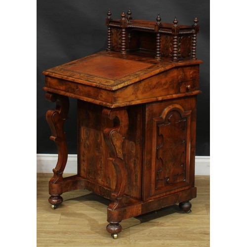 1581 - A 19th century burr yew Davenport desk, possibly Irish, shaped superstructure with a pair of small d... 