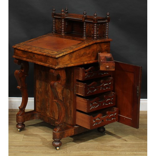 1581 - A 19th century burr yew Davenport desk, possibly Irish, shaped superstructure with a pair of small d... 