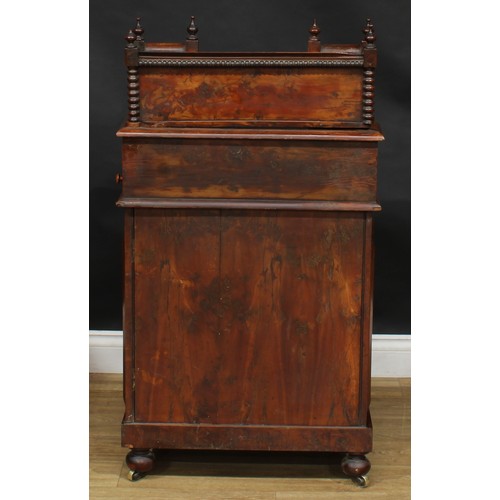 1581 - A 19th century burr yew Davenport desk, possibly Irish, shaped superstructure with a pair of small d... 