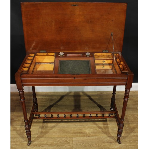 1948 - A late 19th century mahogany chamber writing table or desk, hinged rectangular top and fall front fr... 