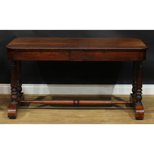 2620 - A William IV rosewood library table, rounded rectangular top with simplified bead and reel edge abov... 