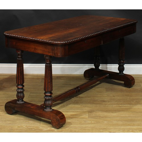 2620 - A William IV rosewood library table, rounded rectangular top with simplified bead and reel edge abov... 