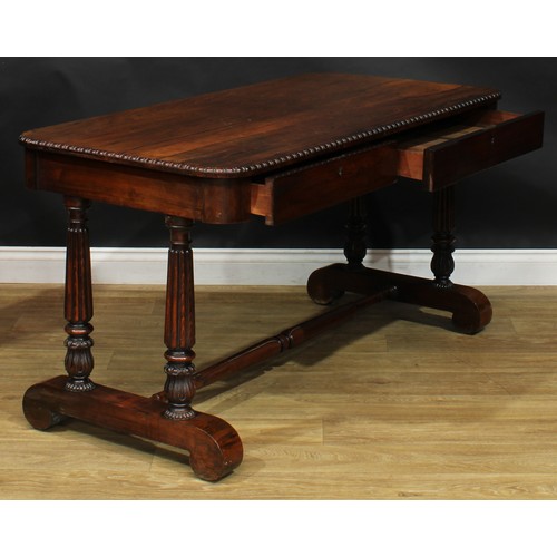 2620 - A William IV rosewood library table, rounded rectangular top with simplified bead and reel edge abov... 