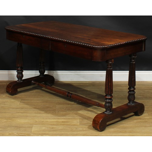 2620 - A William IV rosewood library table, rounded rectangular top with simplified bead and reel edge abov... 