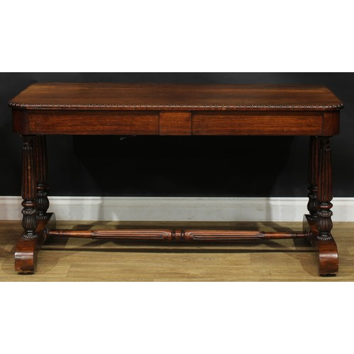 2620 - A William IV rosewood library table, rounded rectangular top with simplified bead and reel edge abov... 