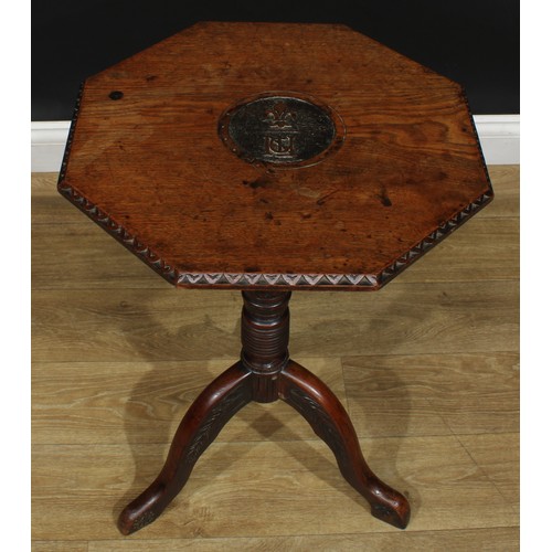 1713 - A 19th century oak tripod occasional table, possibly Masonic, octagonal top carved in relief with a ... 