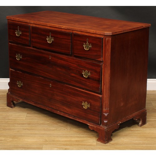 1624 - A 19th century mahogany chest, of three short and two long drawers, flanked by fluted canted angles,... 