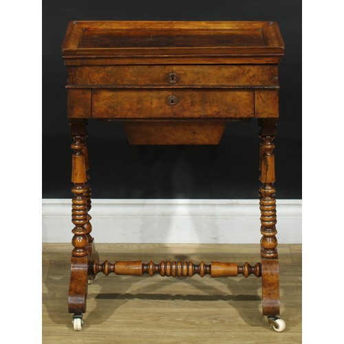 1835 - A late 19th century walnut work table, hinged top enclosing a mirror and compartmented interior abov... 